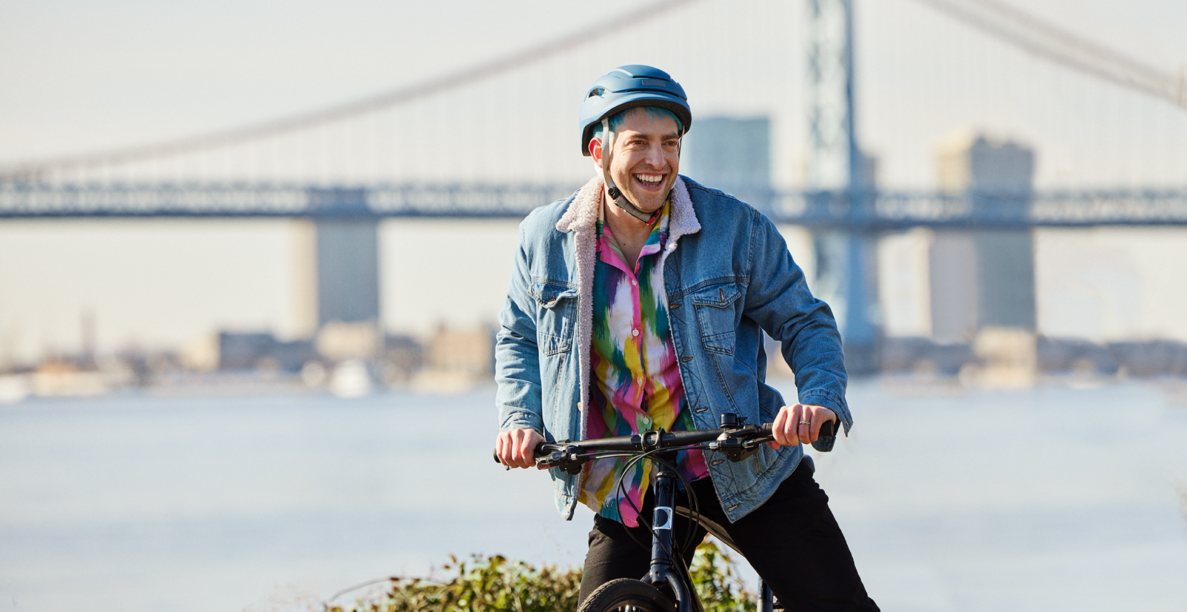 Tim, an actual BEQVEZTM (fidanacogene elaparvovec- dzkt) patient, riding a bicycle with the words, "Tim, who received the BEQVEZ infusion in 2021" and "Tim participated in the BEQVEZ clinical study."